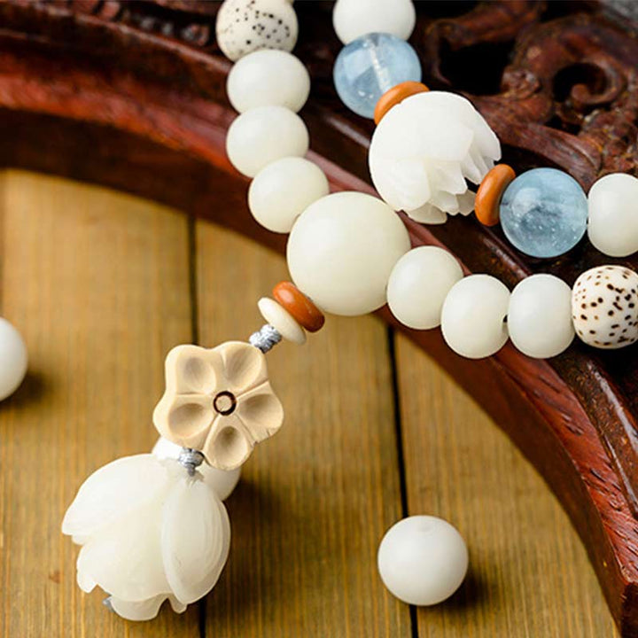 Braccialetto di benedizione del loto Bodhi in giada bianca tibetana Buddha Stones