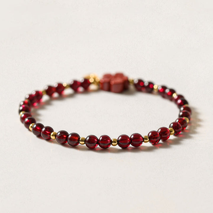 Bracciale Buddha Stones in oro 14K con granato naturale e fiore di cinabro e calma - image 4