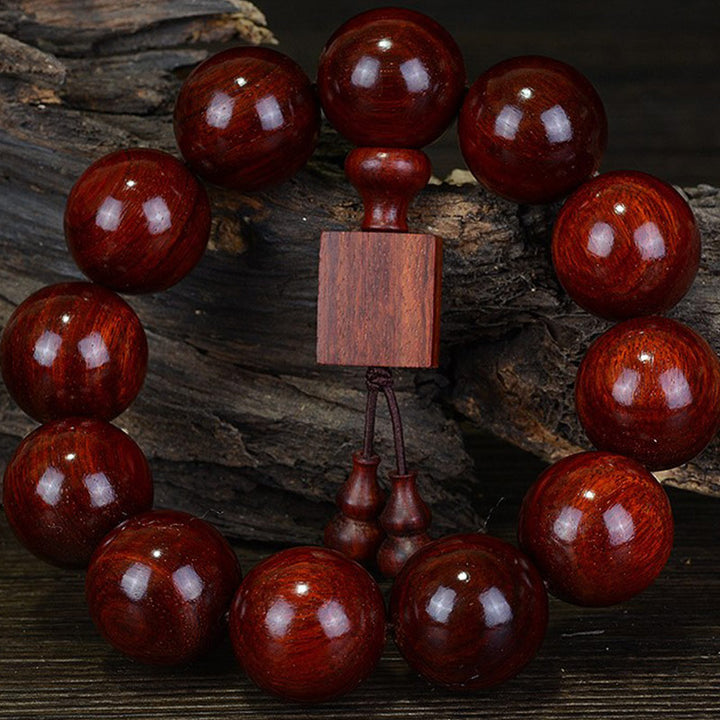 Braccialetto di rilassamento in legno di sandalo rosso con foglie piccole tibetane Buddha Stones
