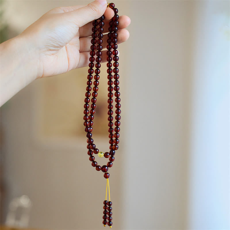 Braccialetto anti-ansia in ambra trasparente con 108 perle di Mala naturali Buddha Stones
