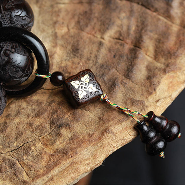 Braccialetto di equilibrio con zucca inciso con carattere cinese Yin Yang in legno di ebano Buddha Stones