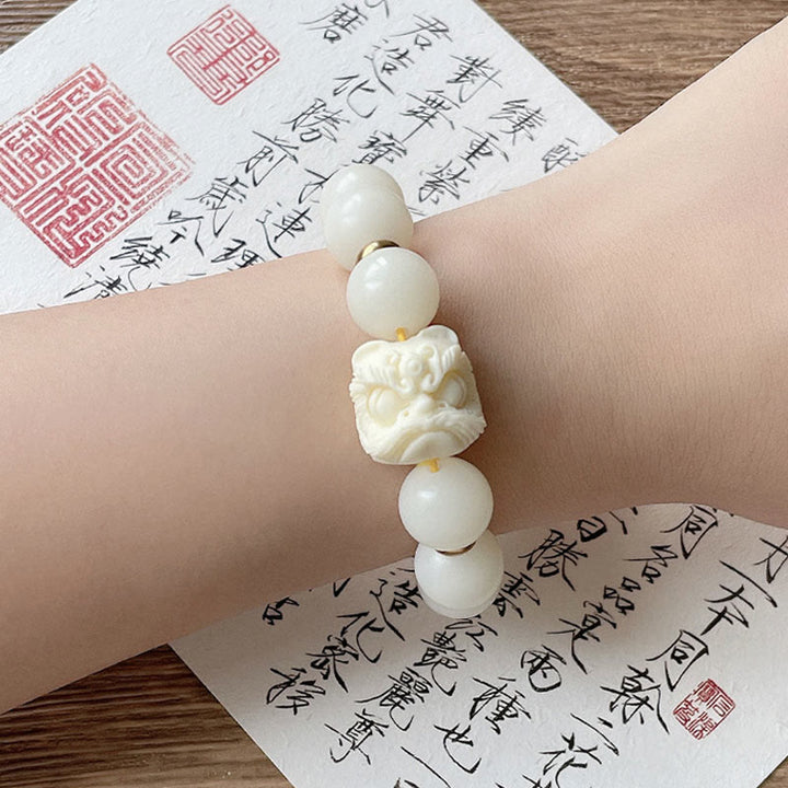 Braccialetto di protezione con leone danzante , Buddha Stones di avorio, seme di Bodhi, pietre di Buddha, argento lucido e ossidiana