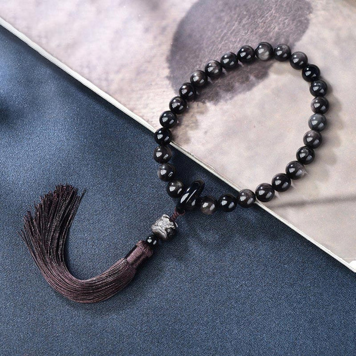 Buddha Stones Argento naturale Ossidiana lucente Leone Mala da polso Protezione Nappe Mala tascabile Decorazione per auto