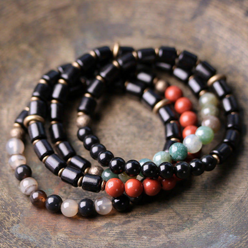 Braccialetto di coppia di pace in rame con Buddha Stones, legno di ebano, diaspro rosso, agata muschiata e cristallo