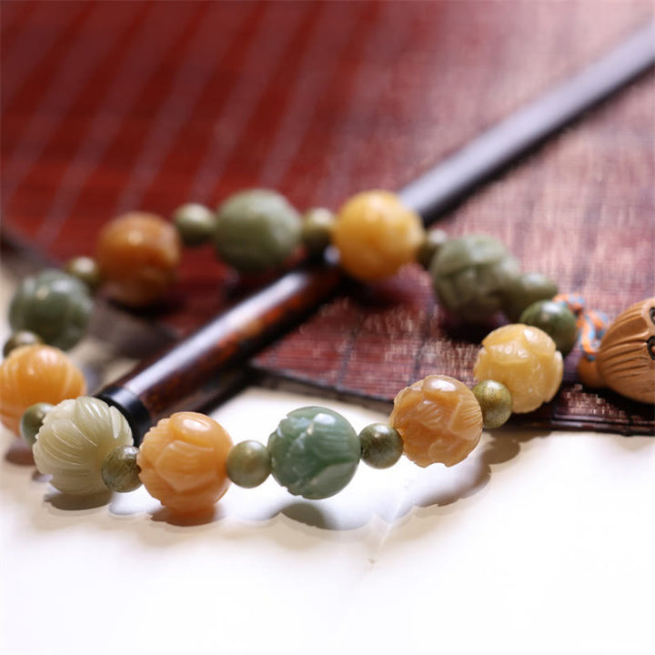 Braccialetto di armonia della saggezza del sandalo verde del seme di Bodhi Buddha Stones