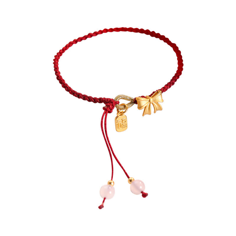 Braccialetto con corda rossa con ciondolo a forma di fiocco con rosetta in fiore di pesco fatto a mano con carattere Fu e nodo Buddha Stones