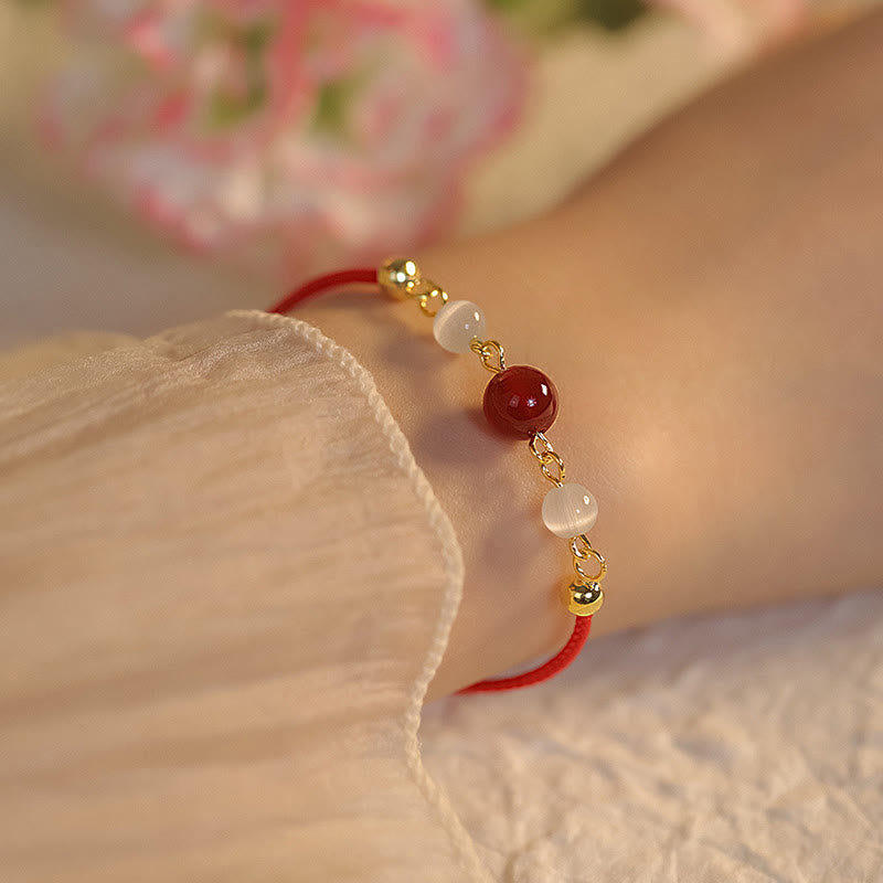 Braccialetto di fiducia in corda intrecciata con occhio di gatto e agata rossa Buddha Stones - Agata rossa e filo rosso (misura braccialetto 15+5 cm) - image 1