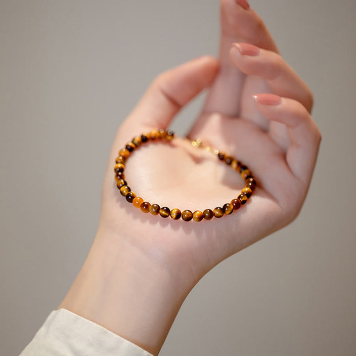 Braccialetto di protezione del coraggio in pietra naturale occhio di tigre placcato oro 14K Buddha Stones