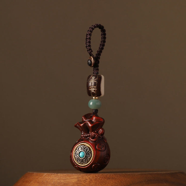 Buddha Stones Piccola foglia Sandalo rosso Sandalo verde Borsa per soldi Om Mani Padme Hum Portachiavi di protezione girevole Decorazione da appendere al telefono - Sandalo rosso a foglia piccola (allontana gli spiriti maligni ♥ Protezione) - Portachiavi - image 0