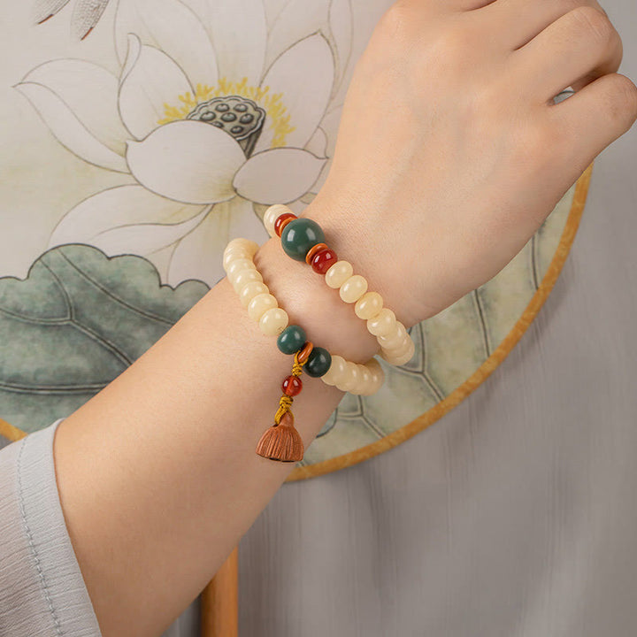 Braccialetto doppio giro Buddha Stones Bodhi Seed Lotus Baccello Charm Peace