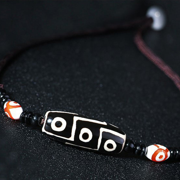 Buddha Stones Collana di perline tibetane Dzi a nove occhi con cordino protettivo - image 3