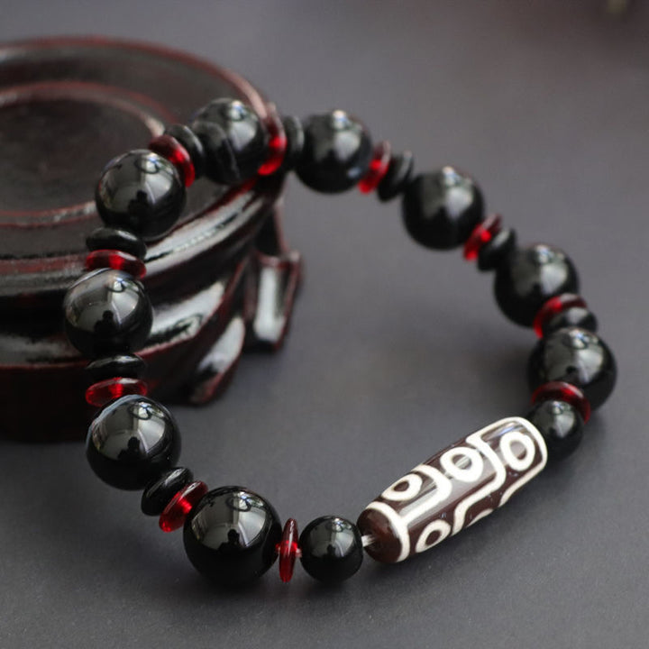 Braccialetto di protezione della ricchezza con perline Dzi a nove occhi in onice nero Buddha Stones