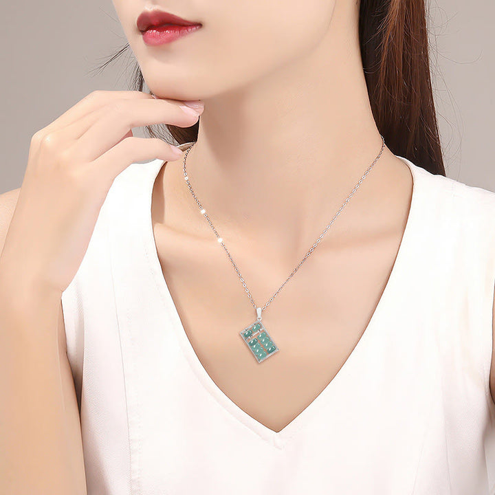 Collana con ciondolo a catena in acciaio al titanio con motivo abaco in giada naturale Buddha Stones - image 10