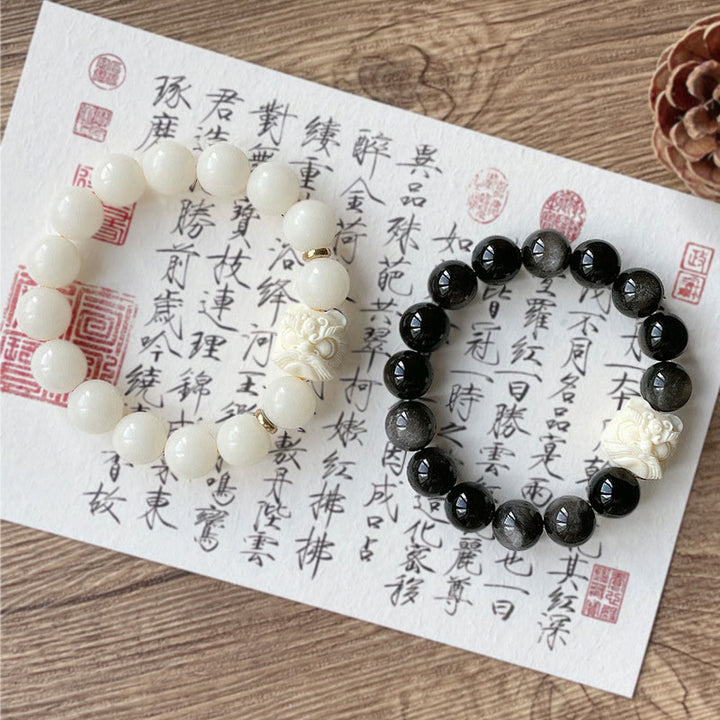 Braccialetto di protezione con leone danzante , Buddha Stones di avorio, seme di Bodhi, pietre di Buddha, argento lucido e ossidiana