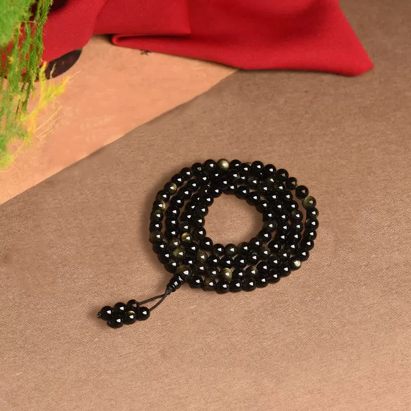 Braccialetto della ricchezza in ossidiana naturale con 108 perle di Mala Buddha Stones