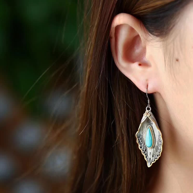 Orecchini pendenti con motivo a foglia di Bodhi in argento sterling 925 con Buddha Stones e turchese