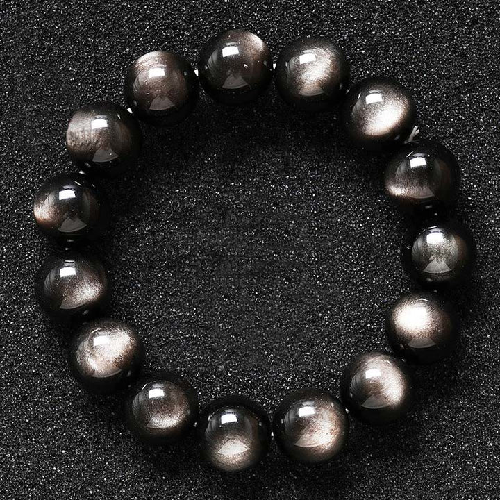 Braccialetto di protezione lenitiva in ossidiana lucida d'argento naturale Buddha Stones