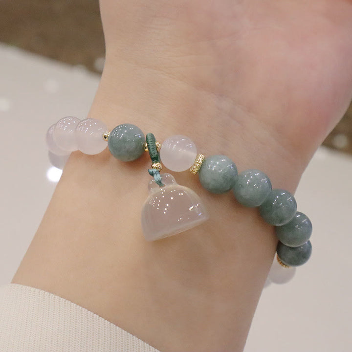 Braccialetto di protezione con fibbia della pace, fiore di loto, agata bianca e giada Buddha Stones