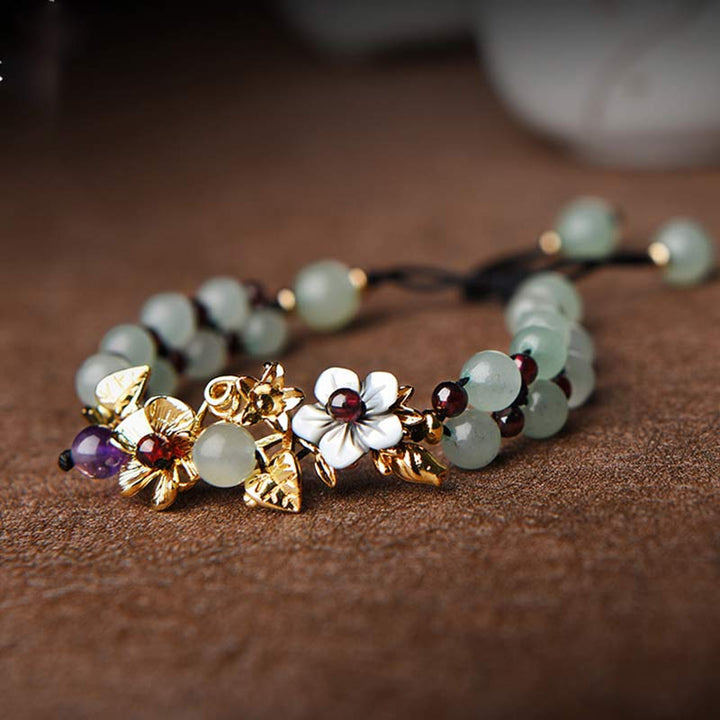 Braccialetto della fortuna con perline di fiore, petalo, avventurina verde e granato Buddha Stones