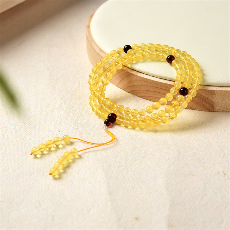 Braccialetto anti-ansia con 108 perline di mala in ambra naturale e trasparente Buddha Stones