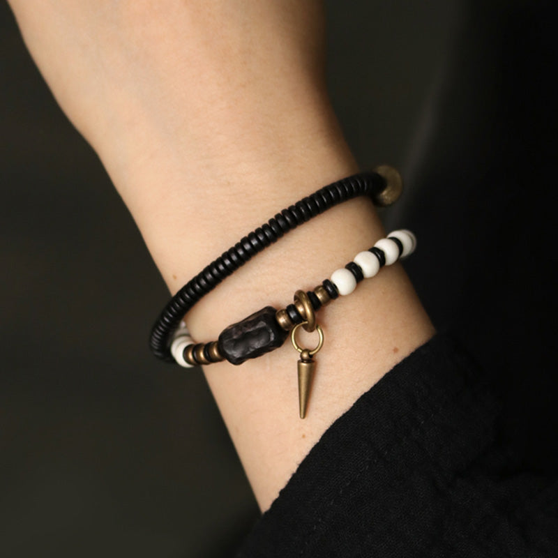 Braccialetto di coppia con perline di osso, ebano, Buddha Stones e rame