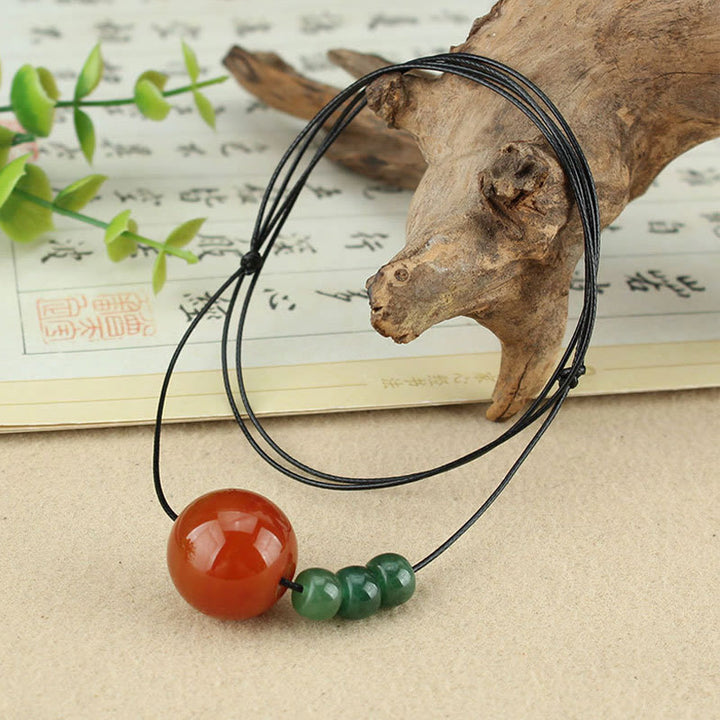 Buddha Stones Agata rossa Avventurina verde Perline di semi di Bodhi verde Collana con ciondolo in corda di cuoio calmo