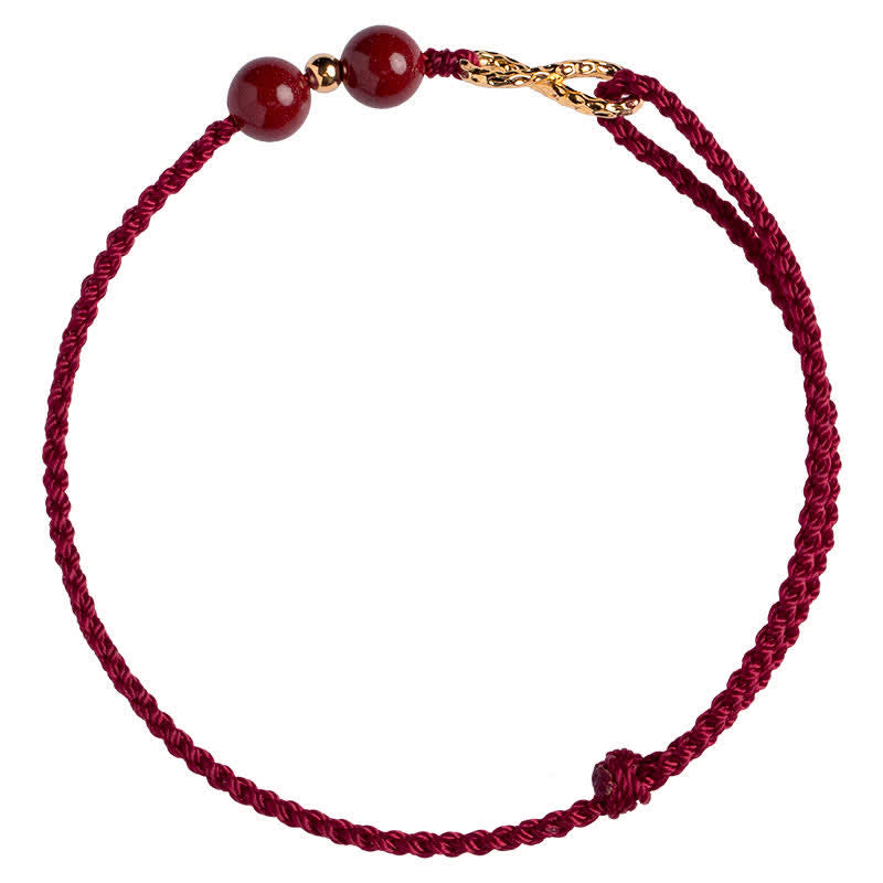 Braccialetto alla cavigliera con simbolo dell'infinito dorato e cordino rosso con Buddha Stones e cinabro. - image 8