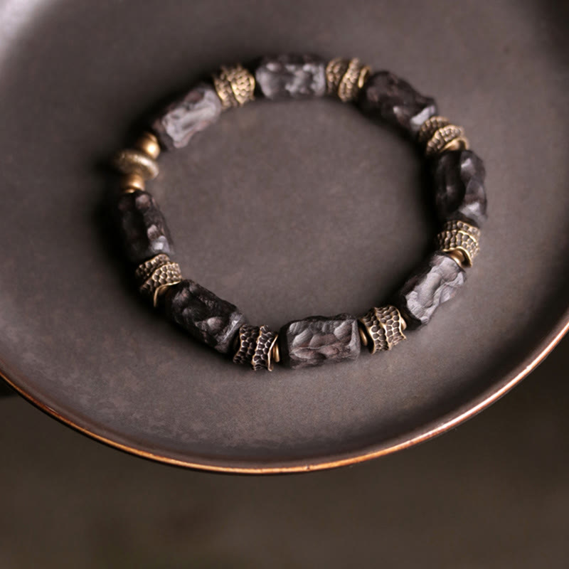 Braccialetto Buddha Stones Tibetano Ebano Legno Rame Calma Pace
