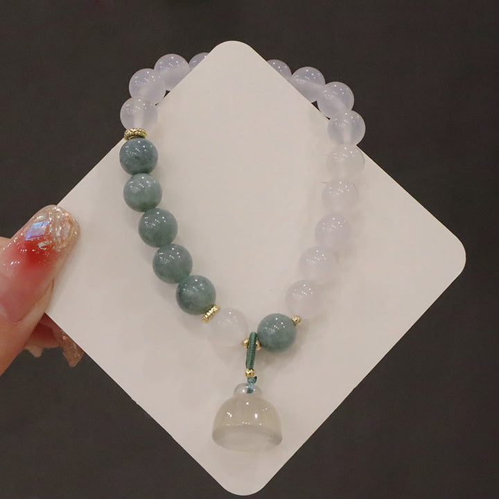 Braccialetto di protezione con fibbia della pace, fiore di loto, agata bianca e giada Buddha Stones