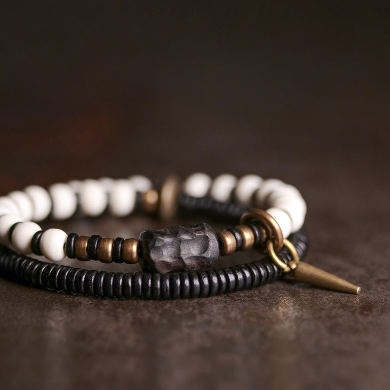 Braccialetto di coppia con perline di osso, ebano, Buddha Stones e rame