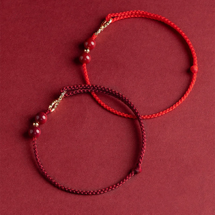 Braccialetto alla cavigliera con simbolo dell'infinito dorato e cordino rosso con Buddha Stones e cinabro. - image 10