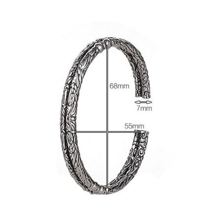 Bracciale rigido con polsino con motivo a drago inciso e bilanciamento