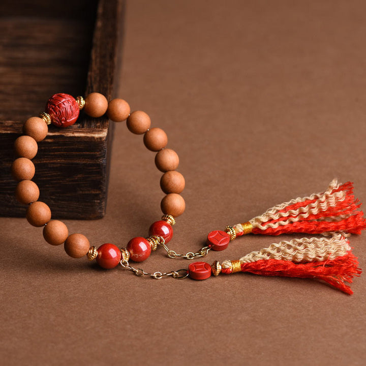 Braccialetto con nappe di ricchezza in legno di pesca naturale tibetano di cinabro PiXiu Buddha Stones