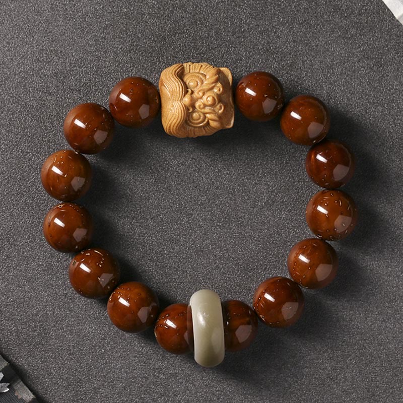 Braccialetto della saggezza del leone danzante dei semi di Bodhi viola Buddha Stones