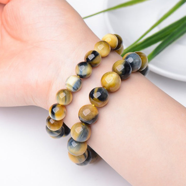 Braccialetto di protezione e forza con occhio di tigre Buddha Stones