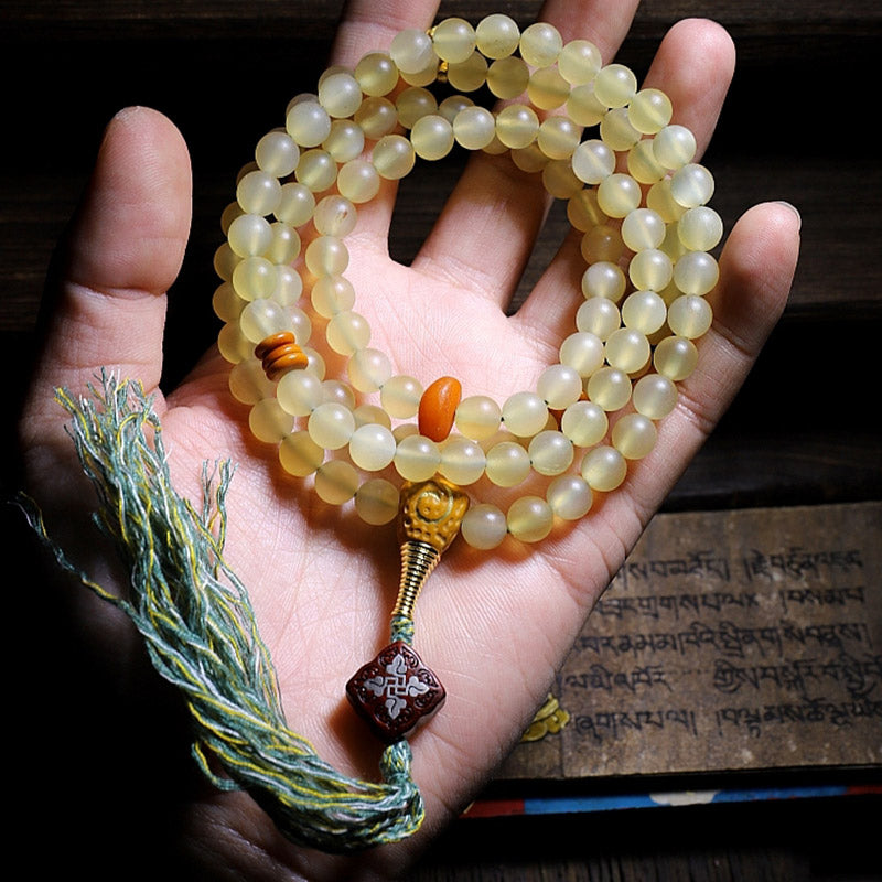 Braccialetto della fortuna in ambra e corno di pecora del Tibet con 108 perle di Mala Buddha Stones