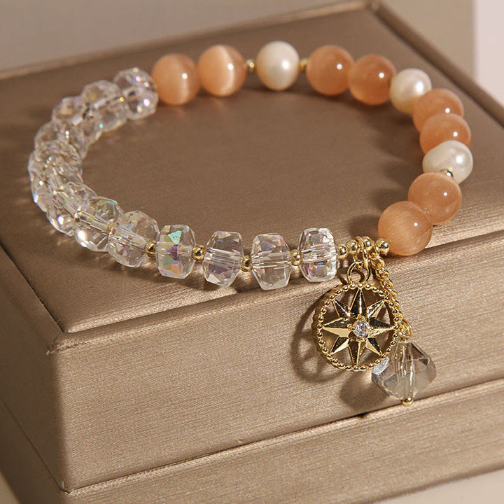 Braccialetto di supporto con stella di cristallo bianco e occhio di gatto arancione Buddha Stones
