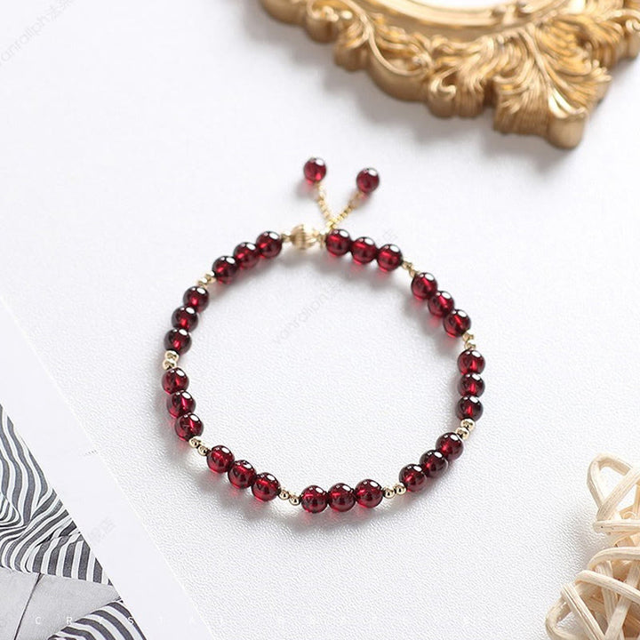 Bracciale Buddha Stones in lega placcata oro 14K con granato naturale e calma - image 3