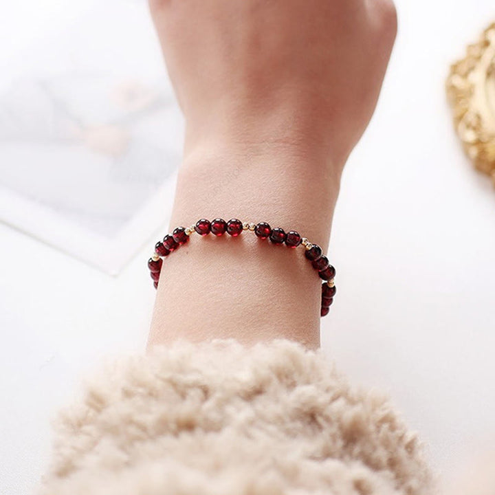 Bracciale Buddha Stones in lega placcata oro 14K con granato naturale e calma - image 6