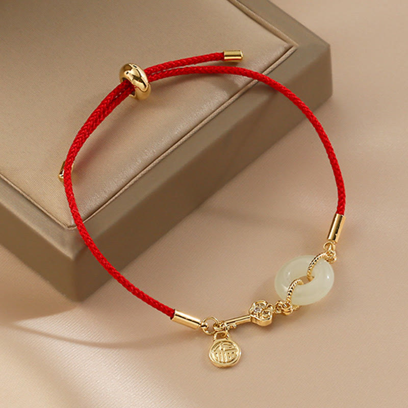 Braccialetto in corda rossa con fibbia della pace in giada Hetian placcato oro 18K con carattere Fu e Buddha Stones