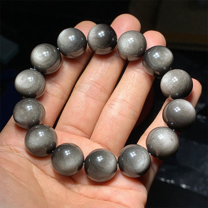 Braccialetto di protezione lenitiva in ossidiana lucida d'argento naturale Buddha Stones