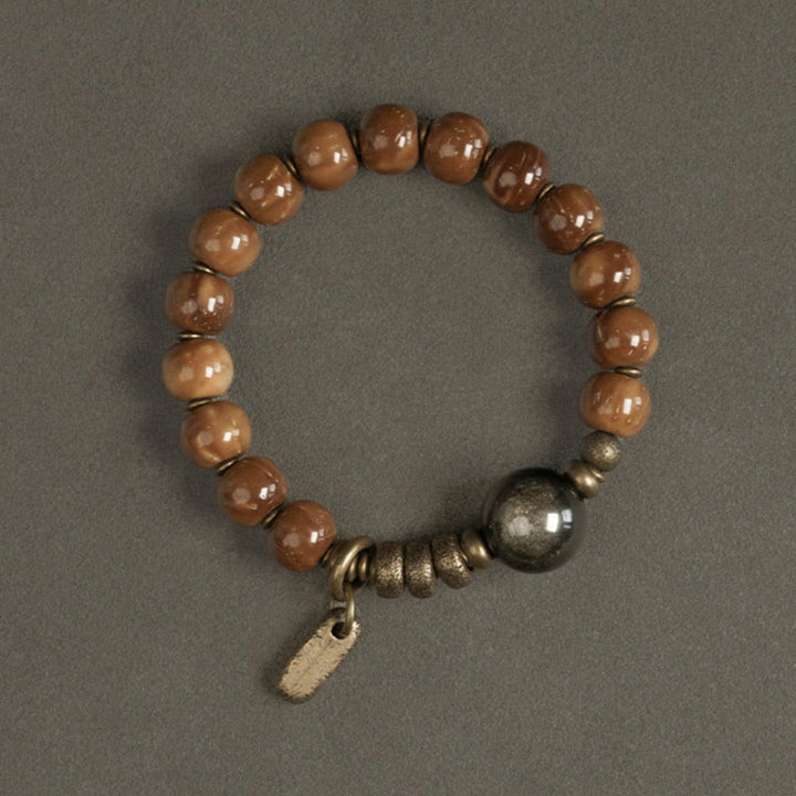 Braccialetto per la fortuna, in ottone, rame e ossidiana , Buddha Stones , semi di Kuka, occhio di tigre e oro lucido - image 7