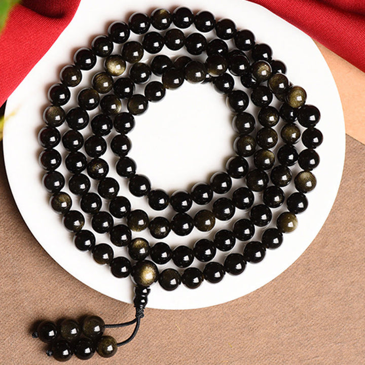 Braccialetto della ricchezza in ossidiana naturale con 108 perle di Mala Buddha Stones