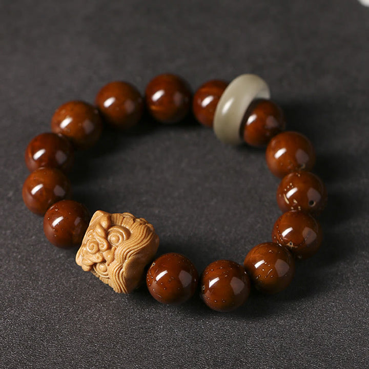 Braccialetto della saggezza del leone danzante dei semi di Bodhi viola Buddha Stones