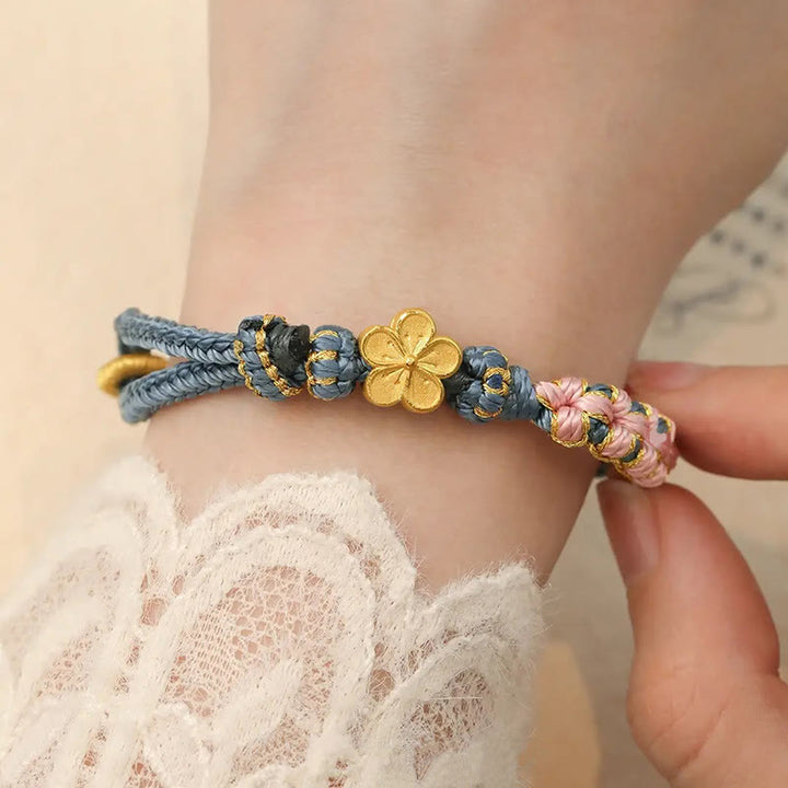 Braccialetto con corda della ricchezza con motivo a fiori di pesco