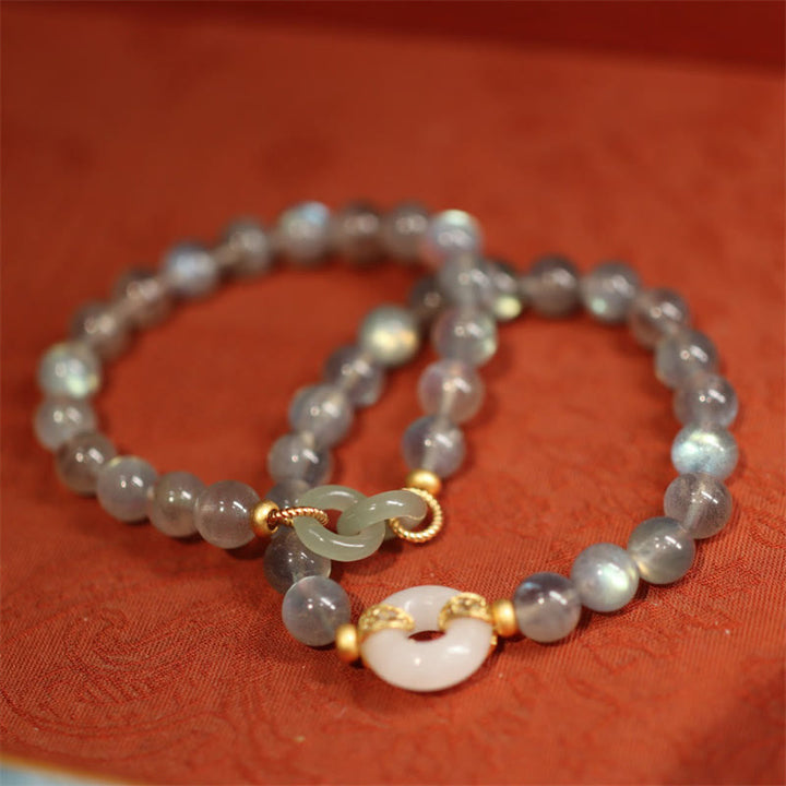 Braccialetto di guarigione con fibbia della pace in giada Heitan, pietra di luna naturale Buddha Stones