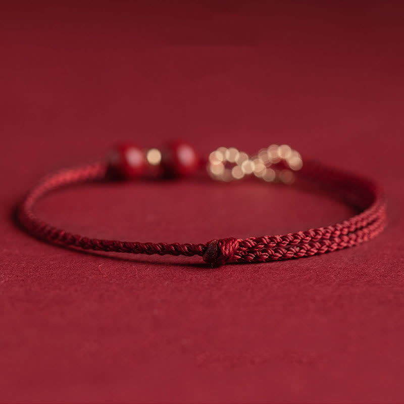 Braccialetto alla cavigliera con simbolo dell'infinito dorato e cordino rosso con Buddha Stones e cinabro. - image 7