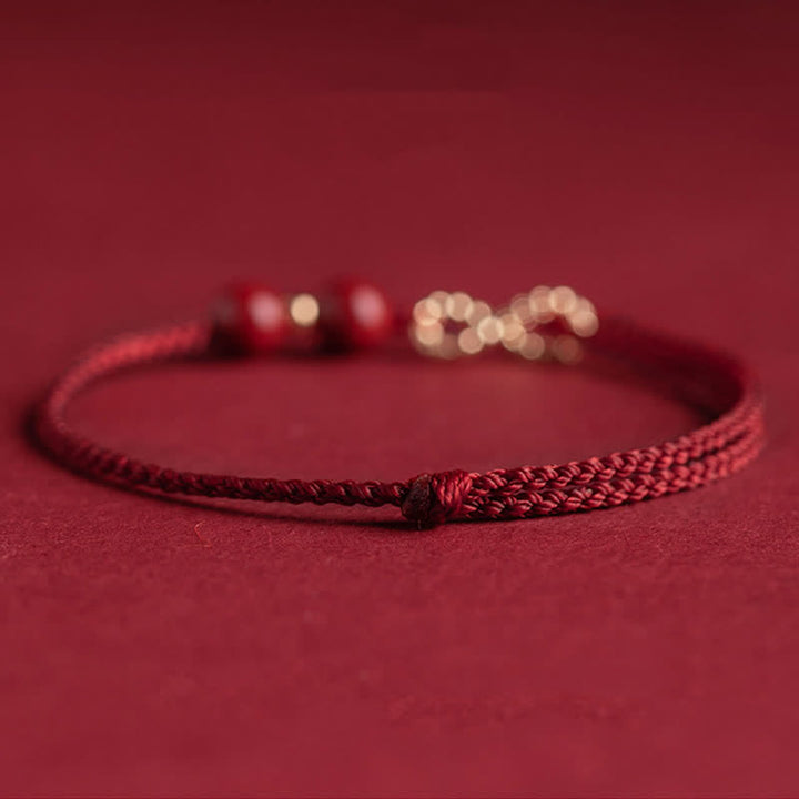 Braccialetto alla cavigliera con simbolo dell'infinito dorato e cordino rosso con Buddha Stones e cinabro. - image 7