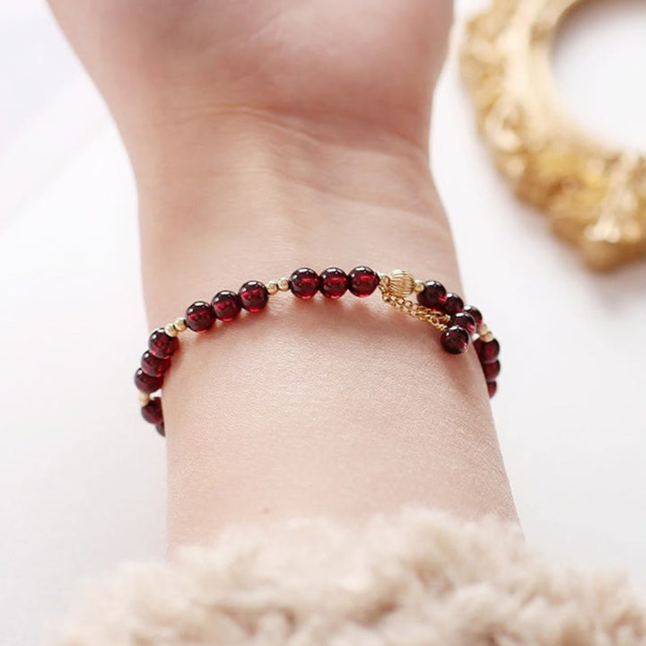 Bracciale Buddha Stones in lega placcata oro 14K con granato naturale e calma - image 7