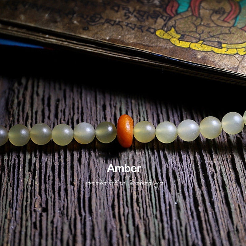 Braccialetto della fortuna in ambra e corno di pecora del Tibet con 108 perle di Mala Buddha Stones